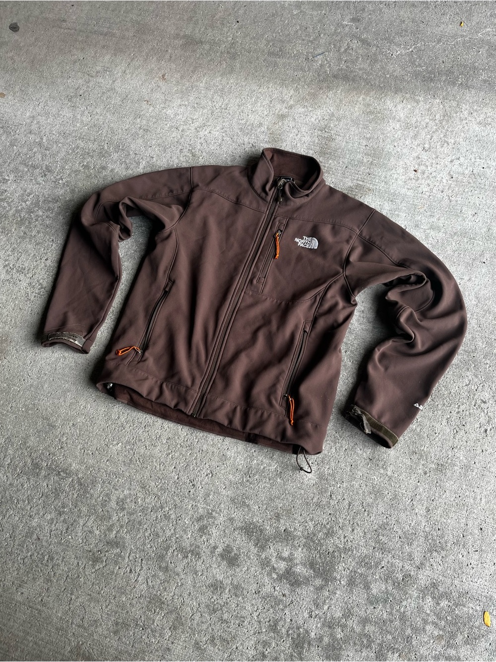 The North Face Men's Brown Softshell Jacket with Orange Accents